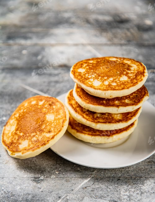 Preview: Pancakes in a plate on the table.