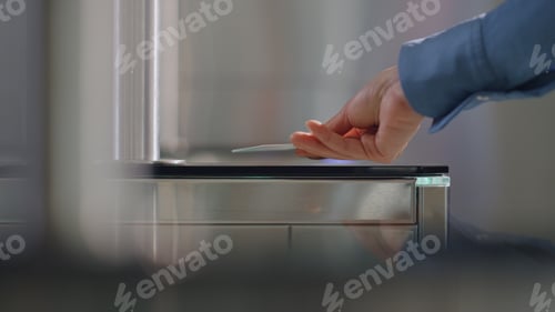 Preview: Woman hand using keycard entering office closeup. Unrecognizable businesswoman