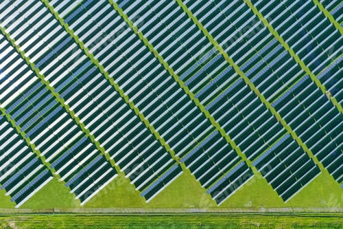 Preview: Solar panels on field in summer, aerial drone view