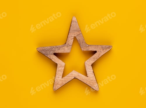 Preview: Christmas star decor on yellow colored background.