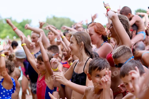 Preview: Group of people wait for having fun, enjoying and dancing at a foam party in aquapark.