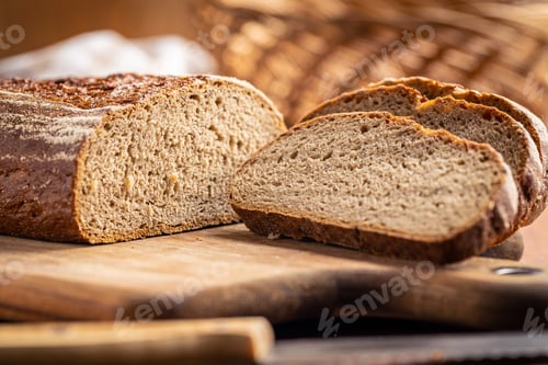 Preview: Sliced loaf of bread on cutting board.