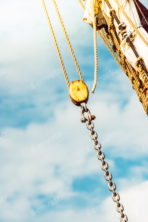 Preview: Sailboat rigging details against bright sky background, ocean theme