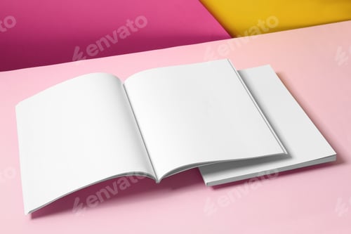Vista previa: Empty book pages on color background. Mockup for design
