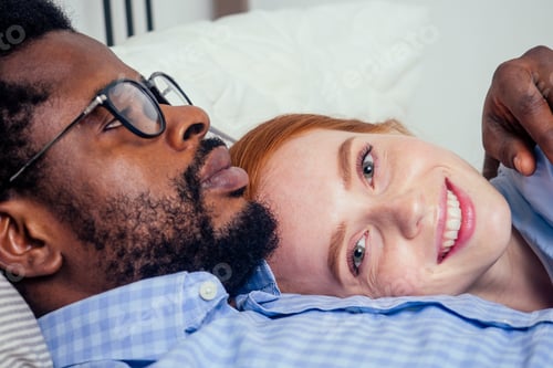 Preview: redhaired ginger caucasian happy female and multi-ethnic afro man together l