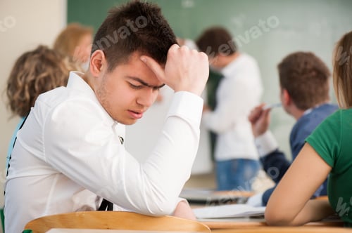 Preview: Nicely Dressed Student Thinking In A Classroom