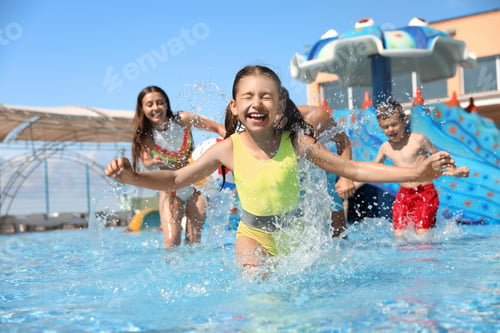 Preview: Happy family having fun at water park. Summer vacation