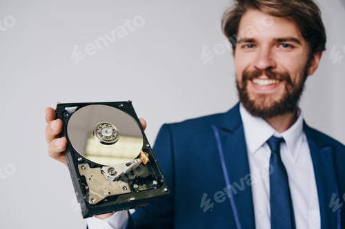 Preview: man holding a hard drive information protection technology