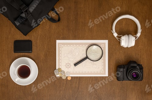Preview: Flat lay travel composition with world map on wooden background.