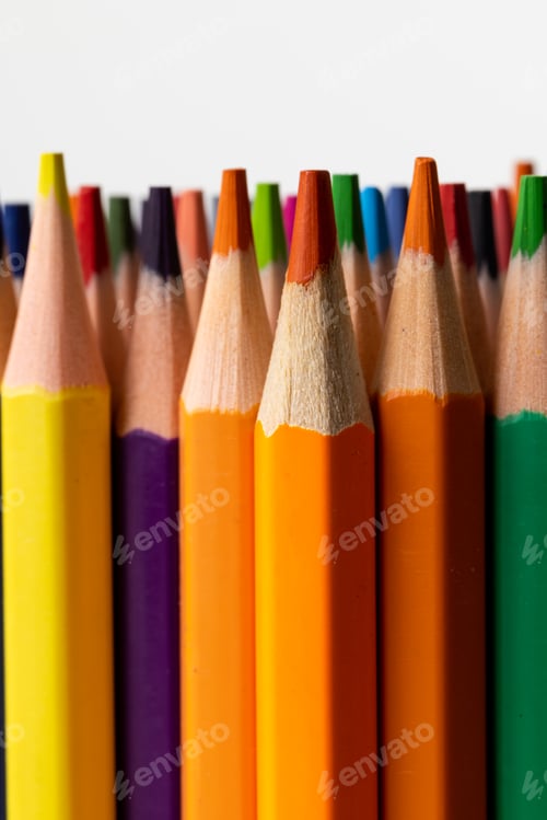 Preview: Vertical image of colorful crayons on white surface