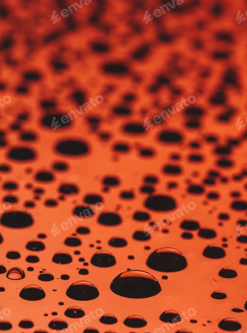 Preview: close up of water droplets on red background useful for wallpapers or backgrounds room for copy