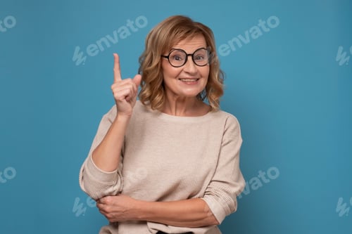 Preview: Woman With Great Idea Posing on Blue Background