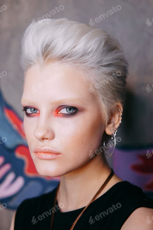 Preview: Portrait of a young fashionable blonde girl with an original hairstyle