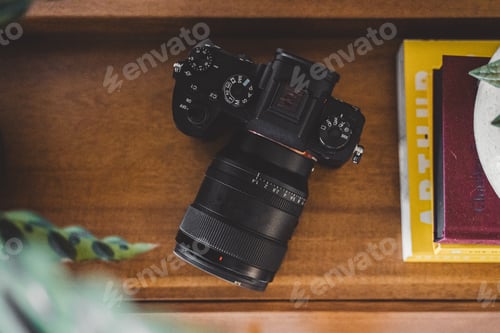 Preview: Mirrorless digital camera on desk overhead view