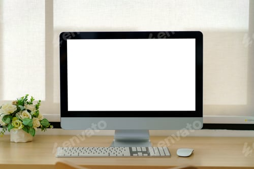 Preview: Laptop computer with blank white screen on table in the office. mock up.