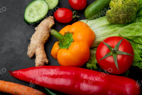 Preview: close-up view of vegetables as pepper, tomato, ginger and others on black background