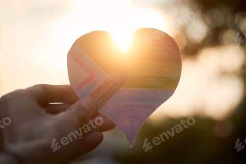 Preview: New LGBT pride flag in the shape of a heart, with sunlight on the back.