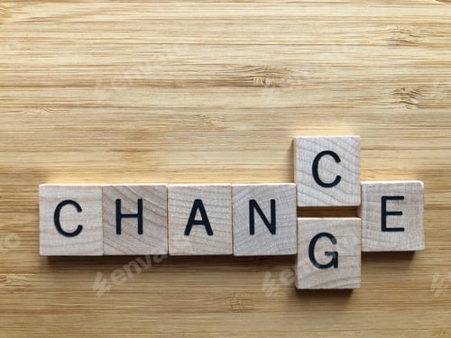 Preview: Chance or Change in wooden alphabet letters isolated on bamboo wood background