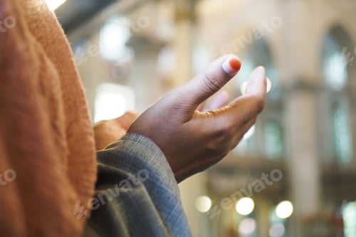Preview: Muslim young woman in hijab is praying in mosque.