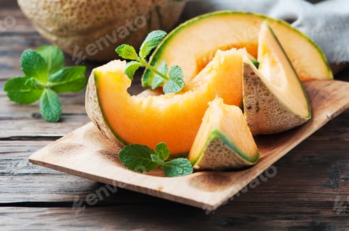 Preview: Fresh sweet orange melon on the wooden table