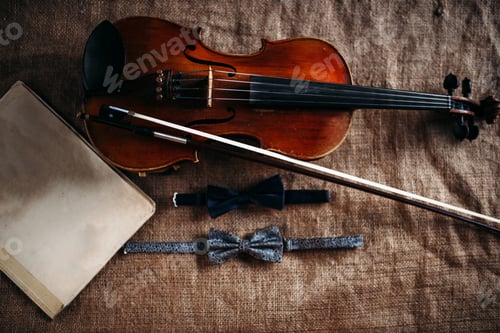 Preview: Violin, fiddlestick, notes and bowties closeup
