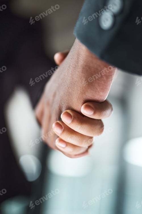 Preview: Cropped shot of two unrecognizable businesspeople shaking hands in an office