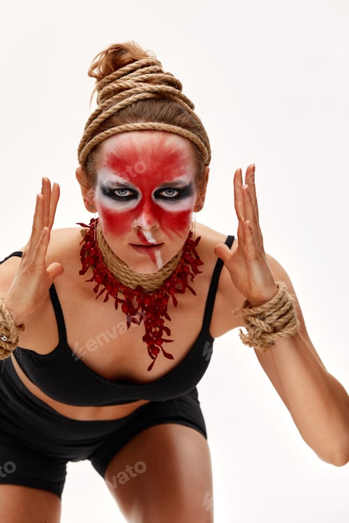 Preview: close up portrait of young beautiful girl with colorful face painting. Halloween professional makeup