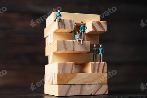 Preview: High-rise building design concept, jenga game, on dark background.