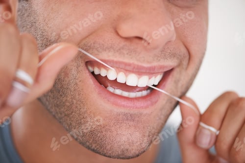 Preview: Oral hygiene. Cropped shot of a man flossing his teeth.