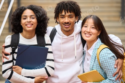 Preview: Smiling Students Posing on Campus Steps Together