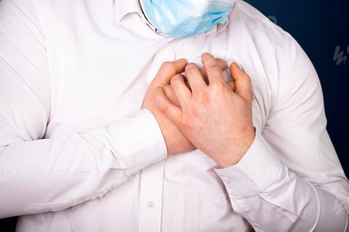Preview: Heart attack concept. Man suffering from chest pain, closeup
