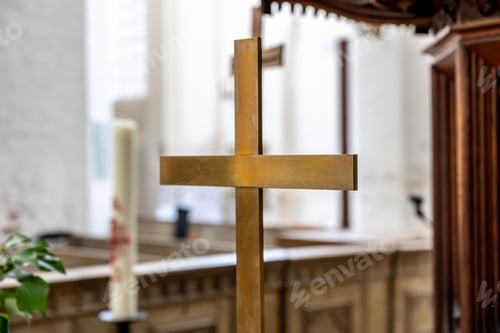 Preview: Golden cross. Church interior. Focus on faith symbol