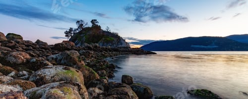 Preview: Rocky shore on Pacific Ocean West Coast. Nature Background. Sunset Sky.