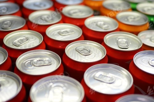 Preview: Cans of soft drink lined up ,