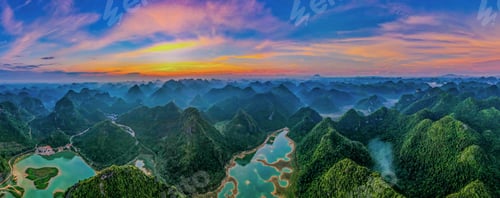 Preview: Aerial view of the mountains surrounded by a river at sunset in Yangshuo County, China