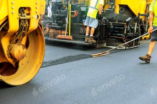 Preview: Road roller at a road construction site, paver laying fresh asphalt pavement during road