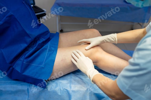 Preview: Doctor visually inspecting and palpating leg veins for vascular evaluation.