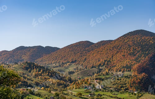 Preview: Stunning landscape of a lush mountainous region with an abundance of trees and majestic peaks
