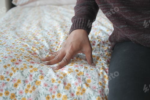 Preview: man Hand touching and pressing orthopedic mattress on bed.