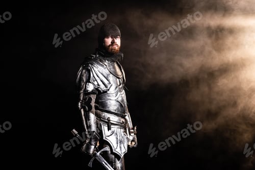 Preview: handsome knight in armor holding sword on black background
