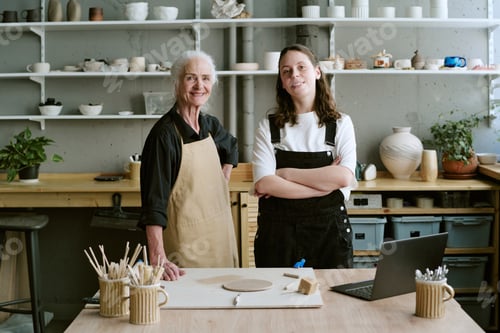 Preview: Senior Woman and Young Adult Woman Working in Pottery Studio
