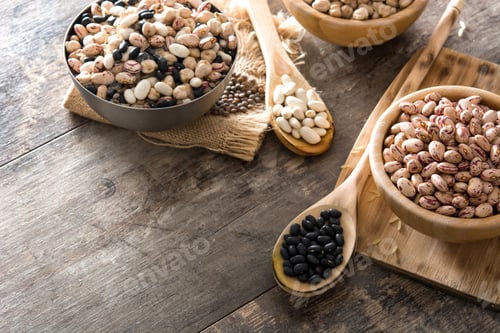 Preview: Various legumes displayed on rustic wooden table