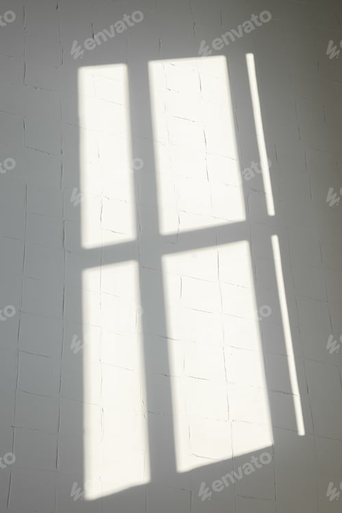 Preview: The silhouette of windows on the wall, created by sunlight that penetrated the room. Сlear lines.