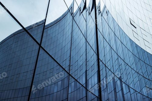 Modern architecture with glass facade reflects city