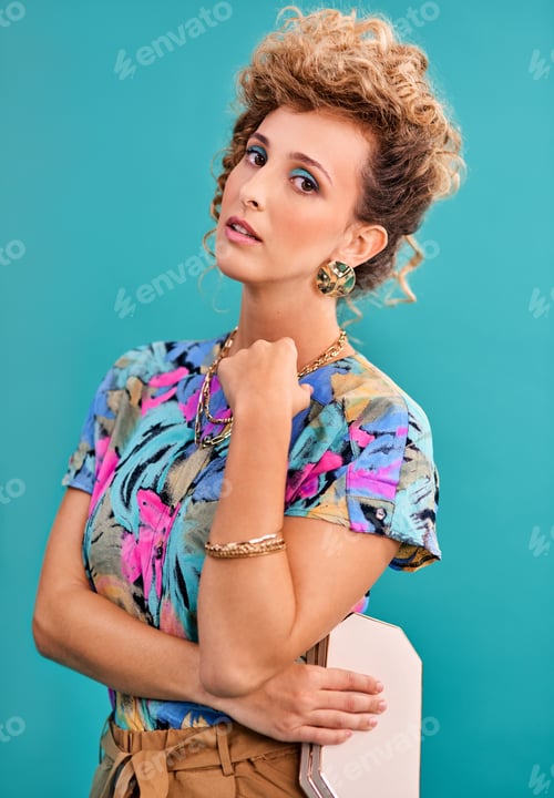 Preview: The 80s were great, darling. Studio shot of a beautiful young woman wearing a 80s outfit.