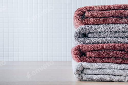 Preview: Towels. Clean fresh fluffy towels on table in bathroom