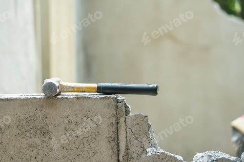 Preview: Hammer put it on crash brick wall in construction site