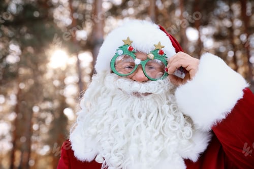 Preview: Happy Authentic Santa Claus with funny glasses outdoors, space for text