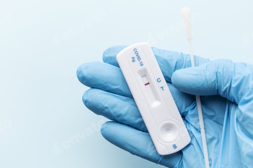 Preview: Doctor holding a negative result for COVID-19 with test kit for viral disease.