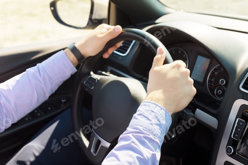 Preview: Man driving a car